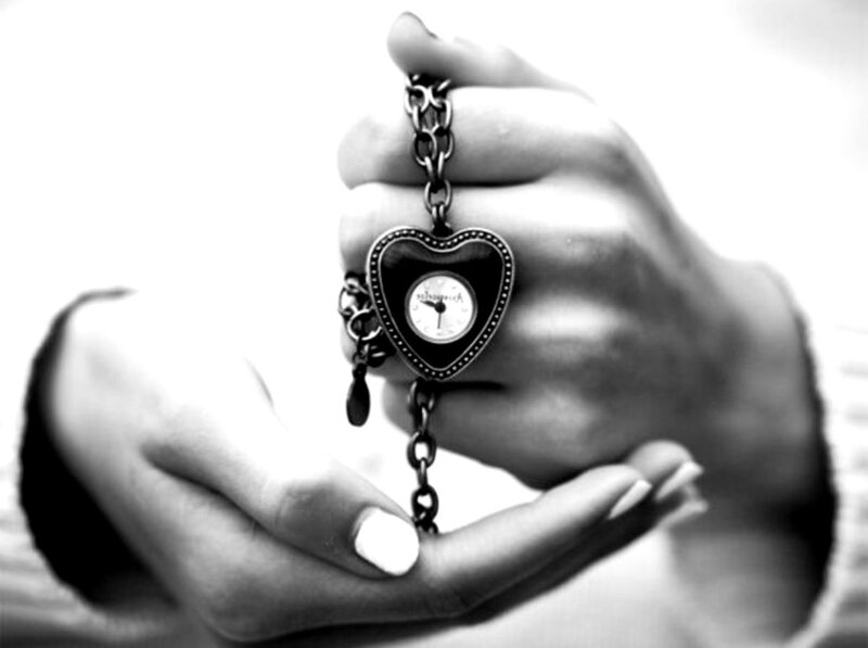 Hands Holding Heart-shaped Watch