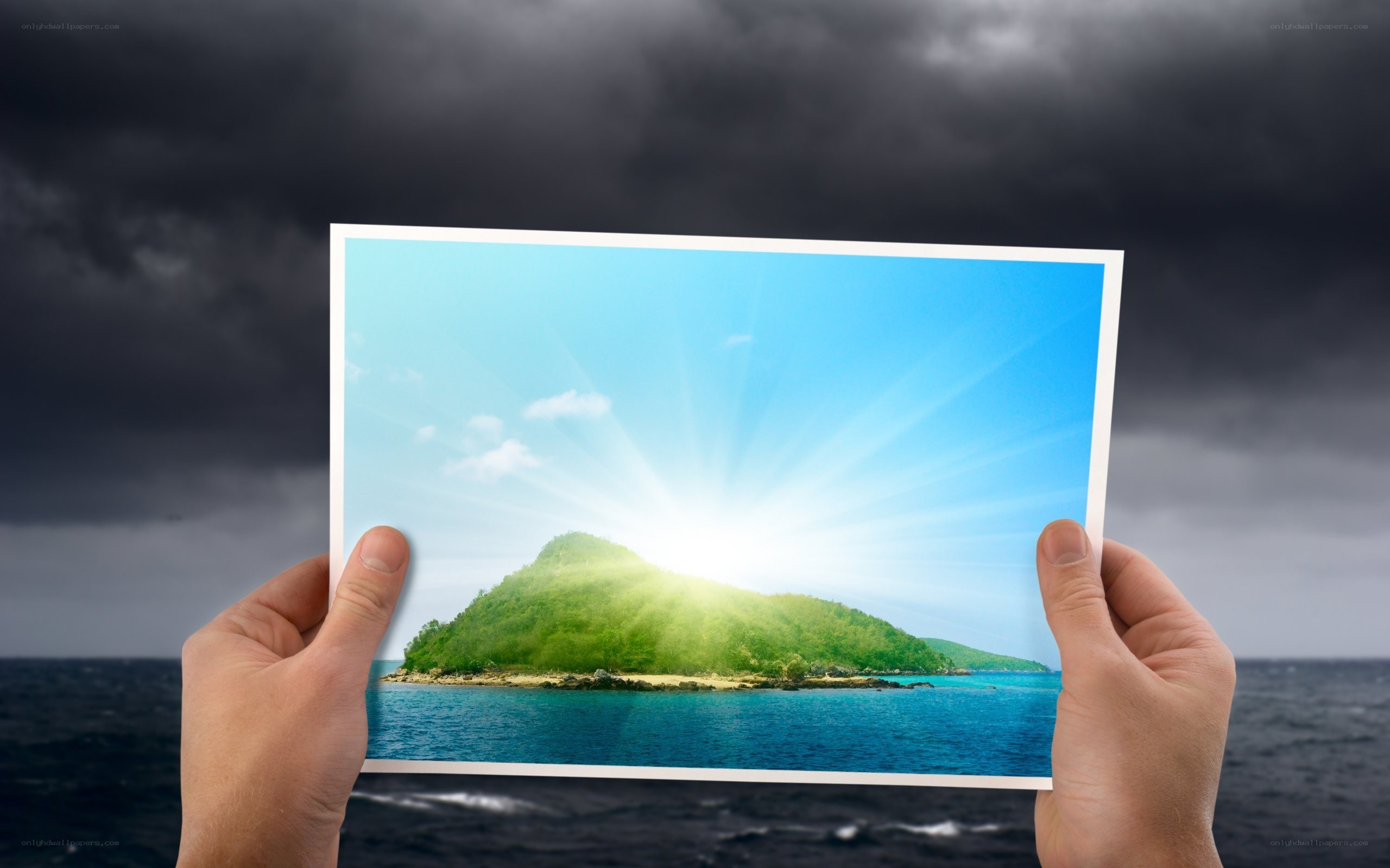 hands holding island photo