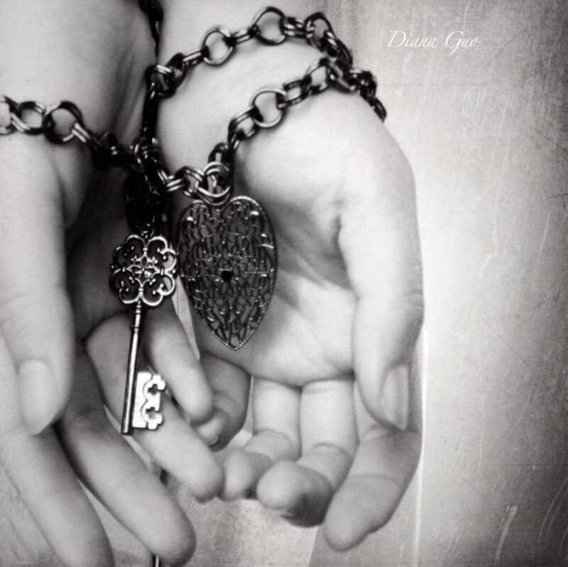 Hands Holding Key and Heart