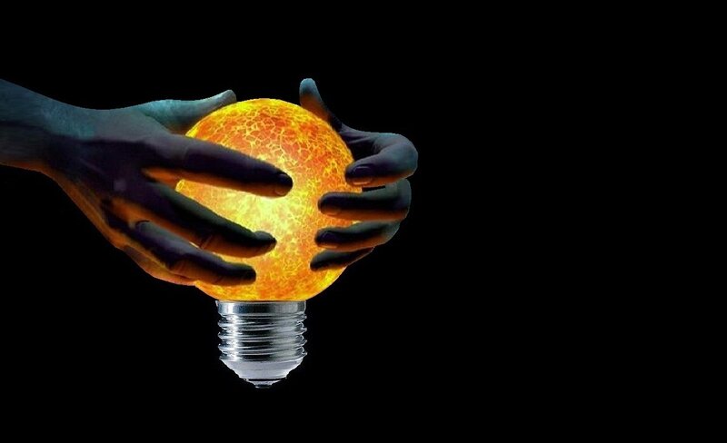 Hands Holding Light Bulb
