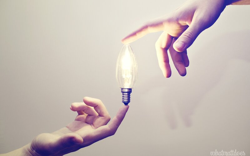 Hands Holding Light Bulb — White