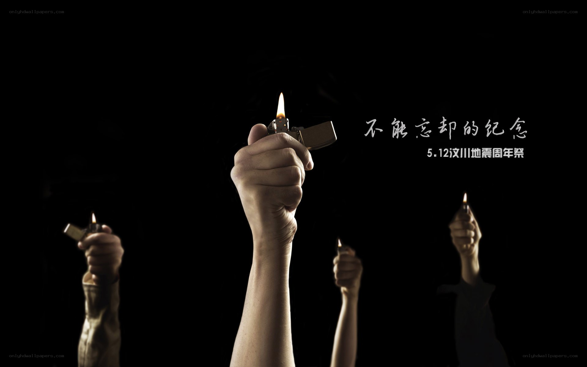 Hands holding lighters in memory