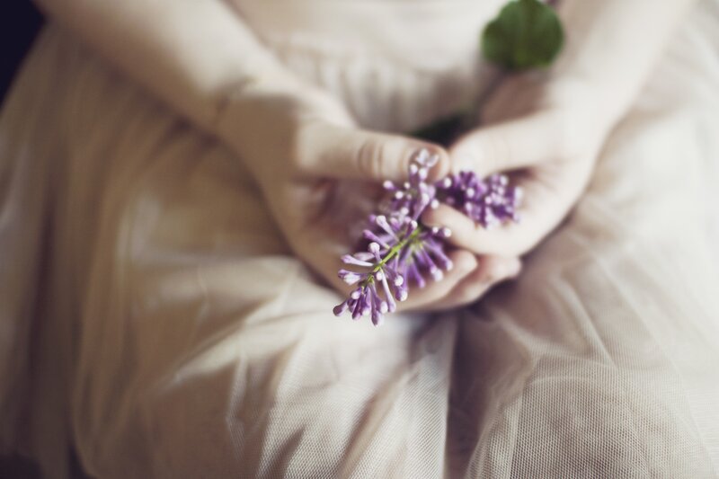 Hands Holding Lilac Flowers