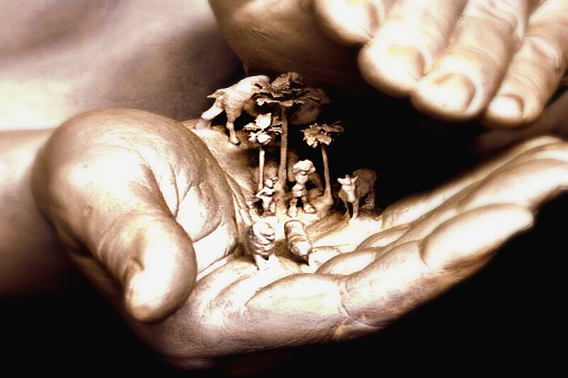 Hands Holding Miniature Scene
