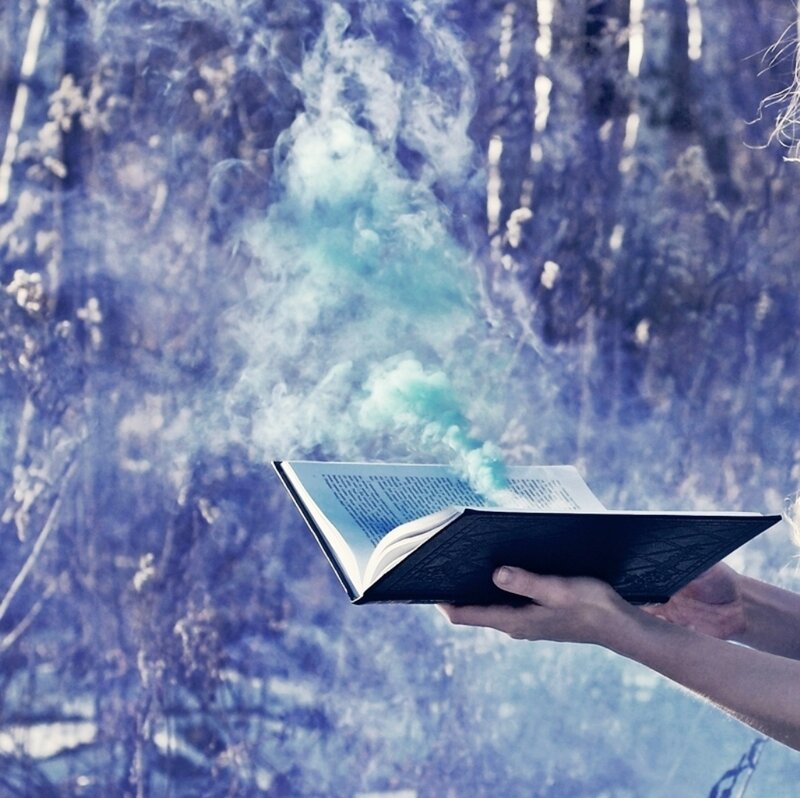 Hands Holding Open Book