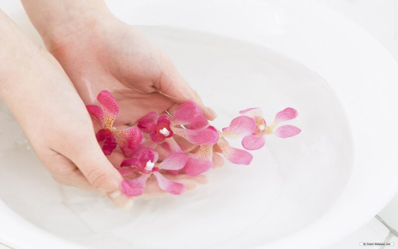 Hands Holding Orchids