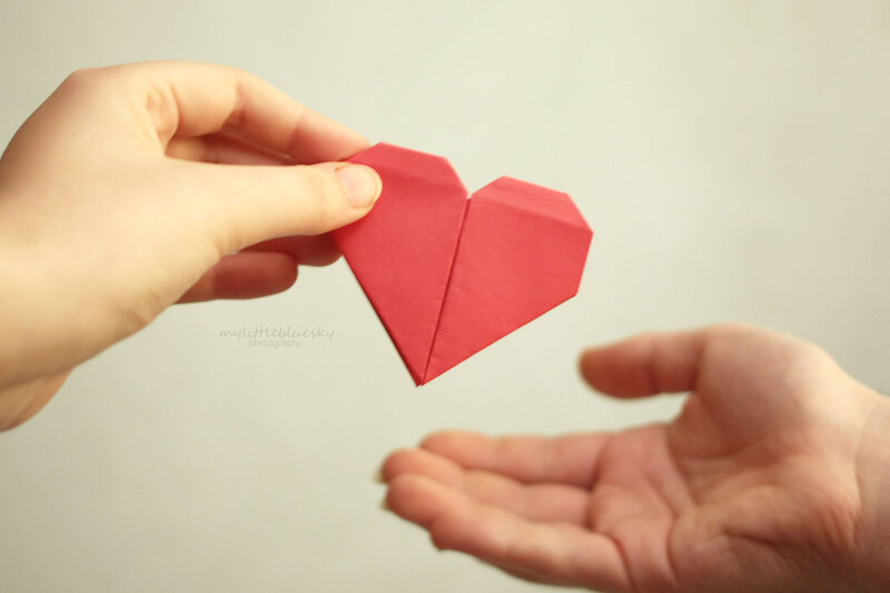 Hands Holding Origami Heart