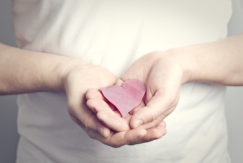 Hands Holding Paper Heart — Pink