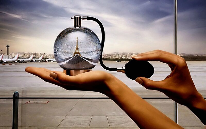 Hands Holding Perfume Bottle — Gray