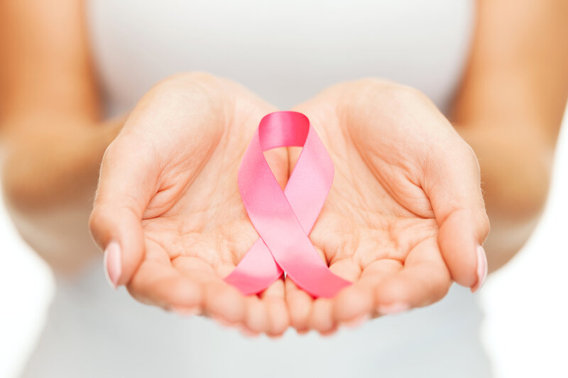 Hands Holding Pink Ribbon