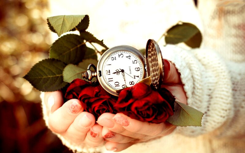 Hands Holding Pocket Watch — Red