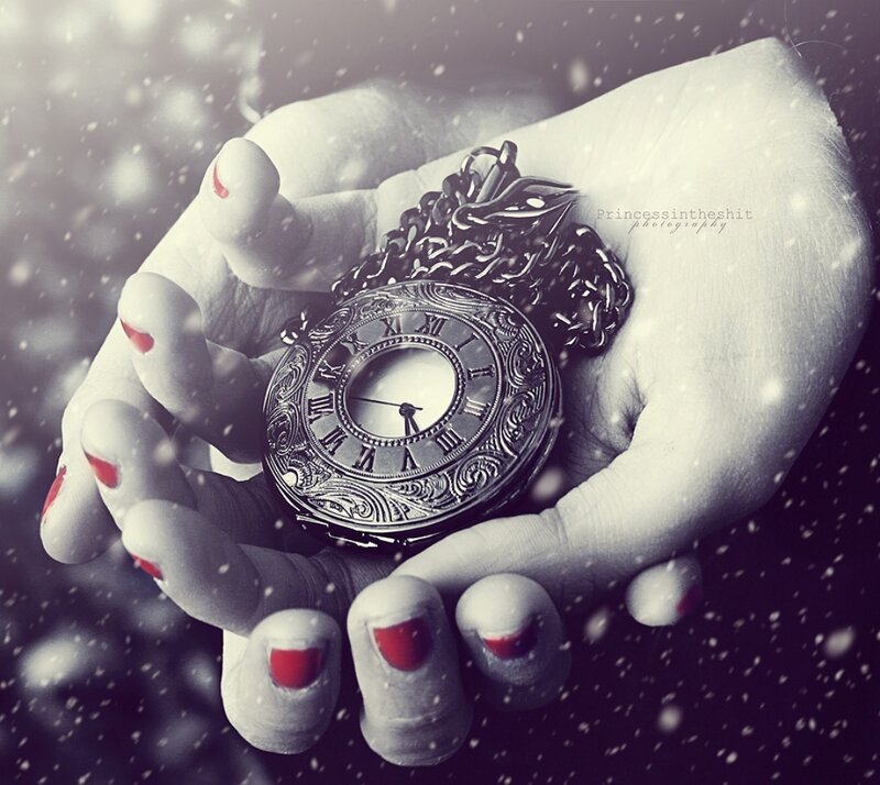 Hands Holding Pocket Watch