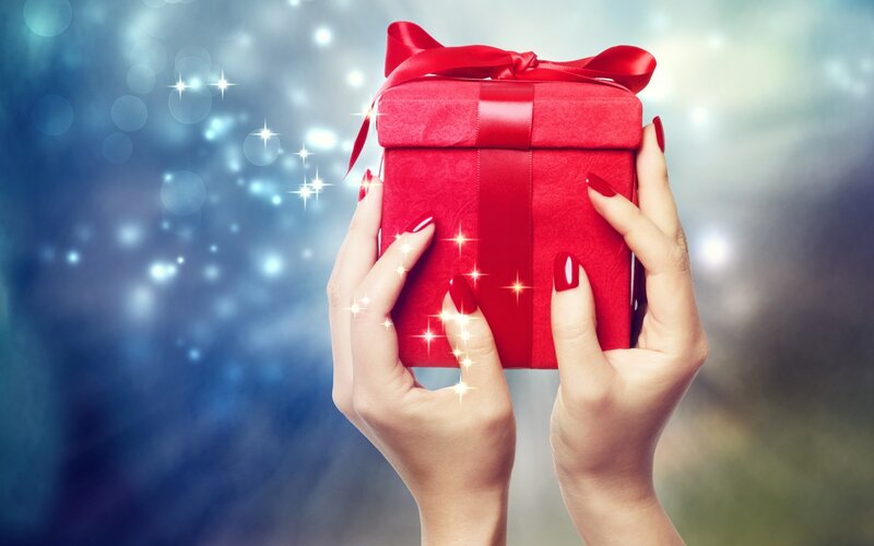 Hands Holding Red Gift — Festive