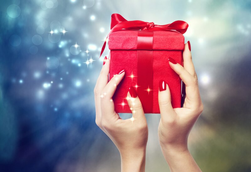 Hands Holding Red Gift