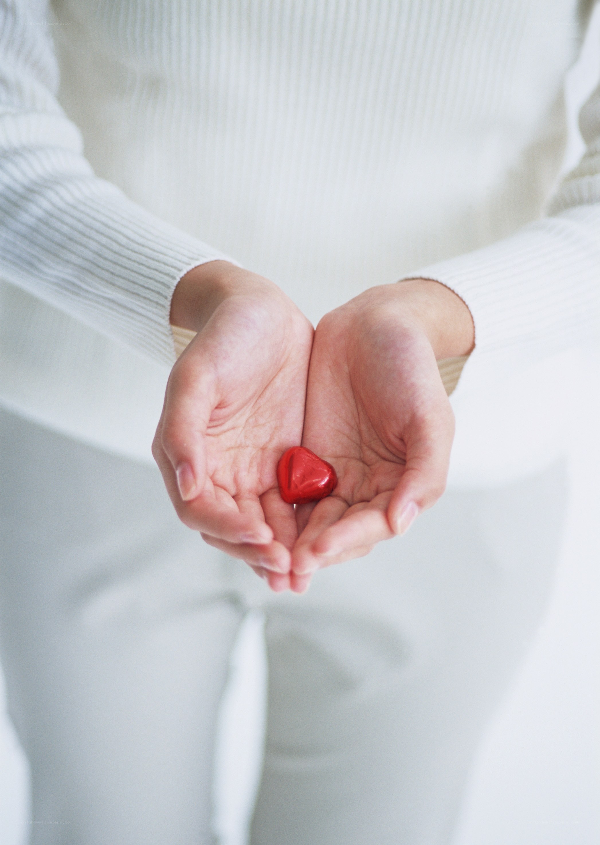 hands holding red heart