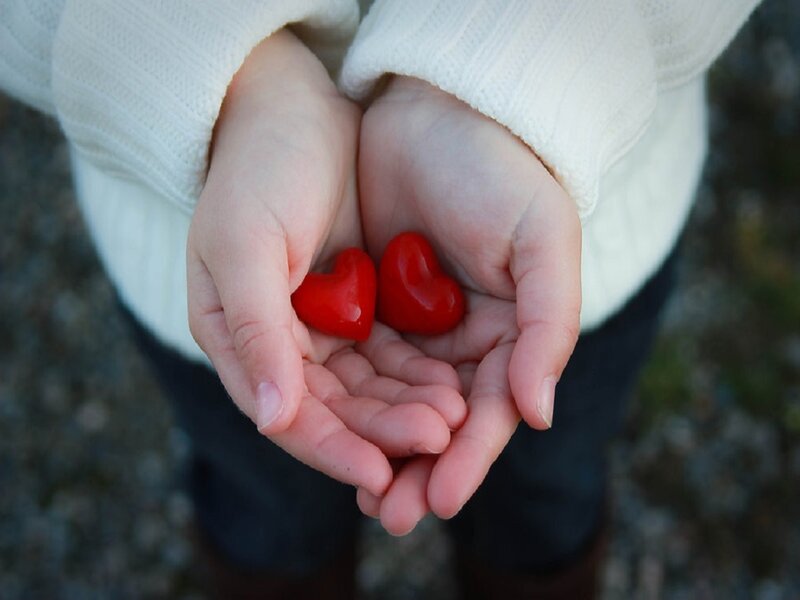 Hands Holding Red Hearts — Calm, Photograph