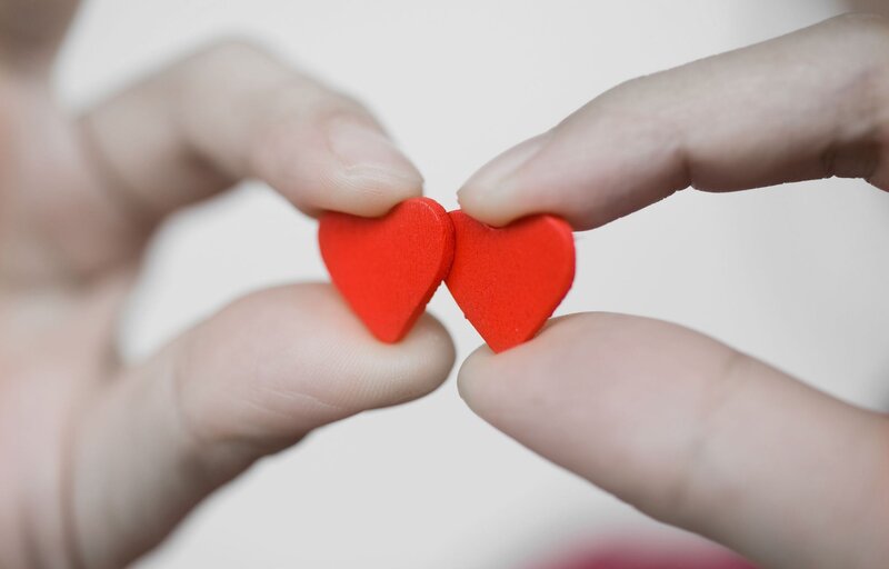 Hands Holding Red Hearts — Calm