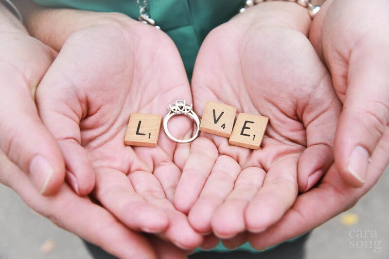 Hands Holding Ring and Tiles