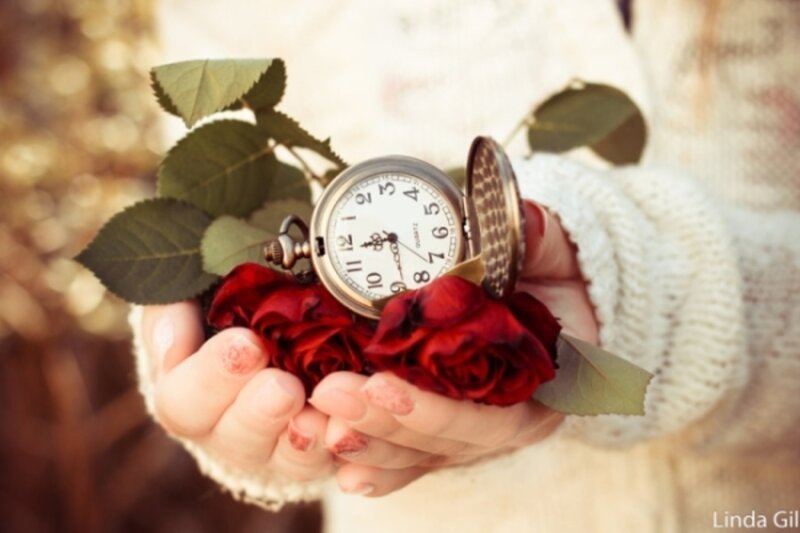 Hands Holding Roses and Pocket Watch