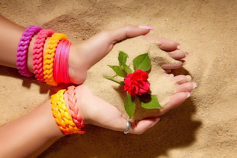 Hands Holding Sand and Flower