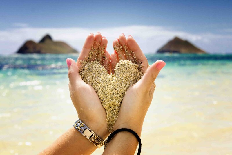 Hands Holding Sand Heart