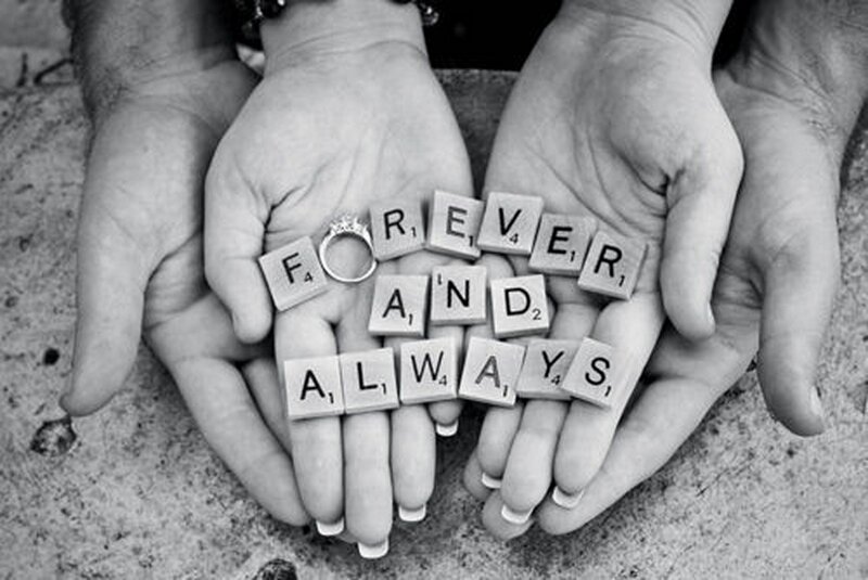 Hands Holding Scrabble Tiles