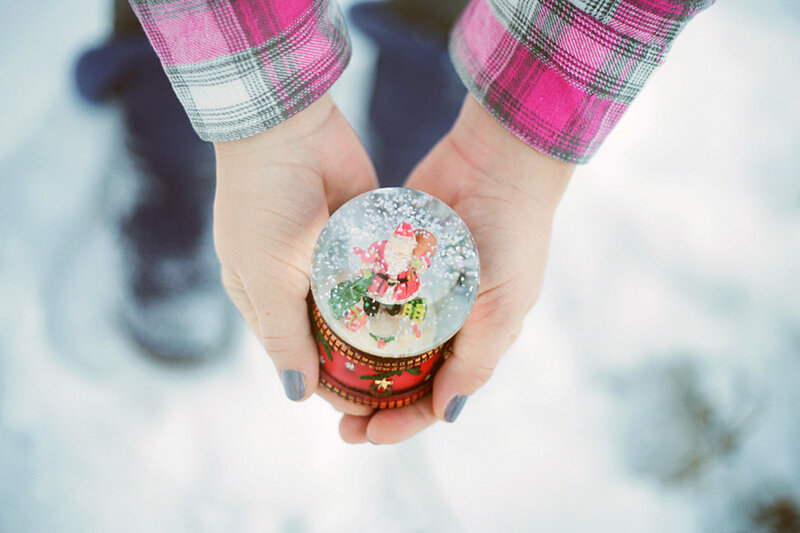Hands Holding Snow Globe