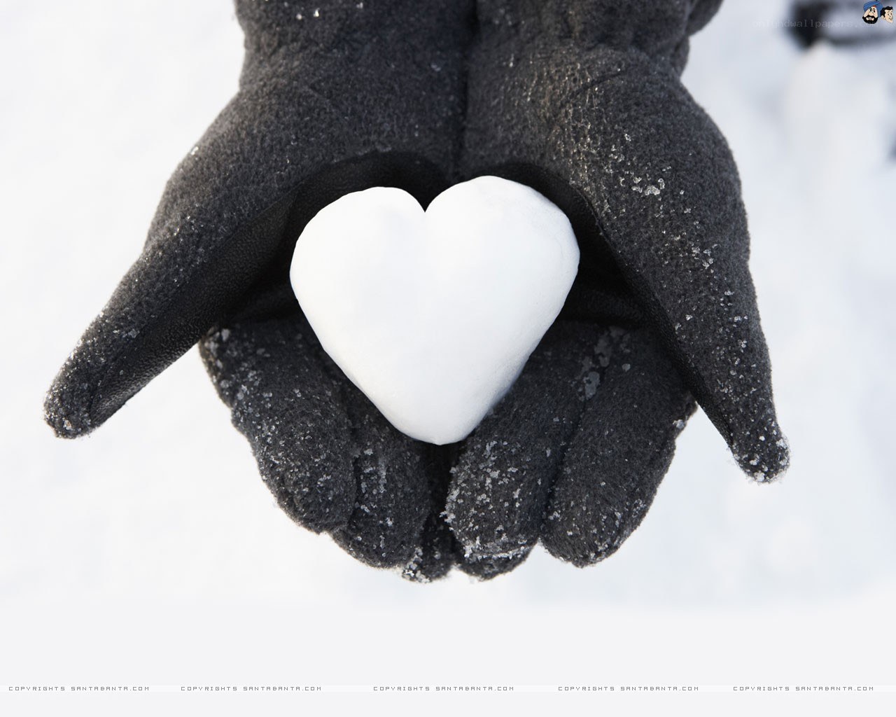 hands holding snow heart