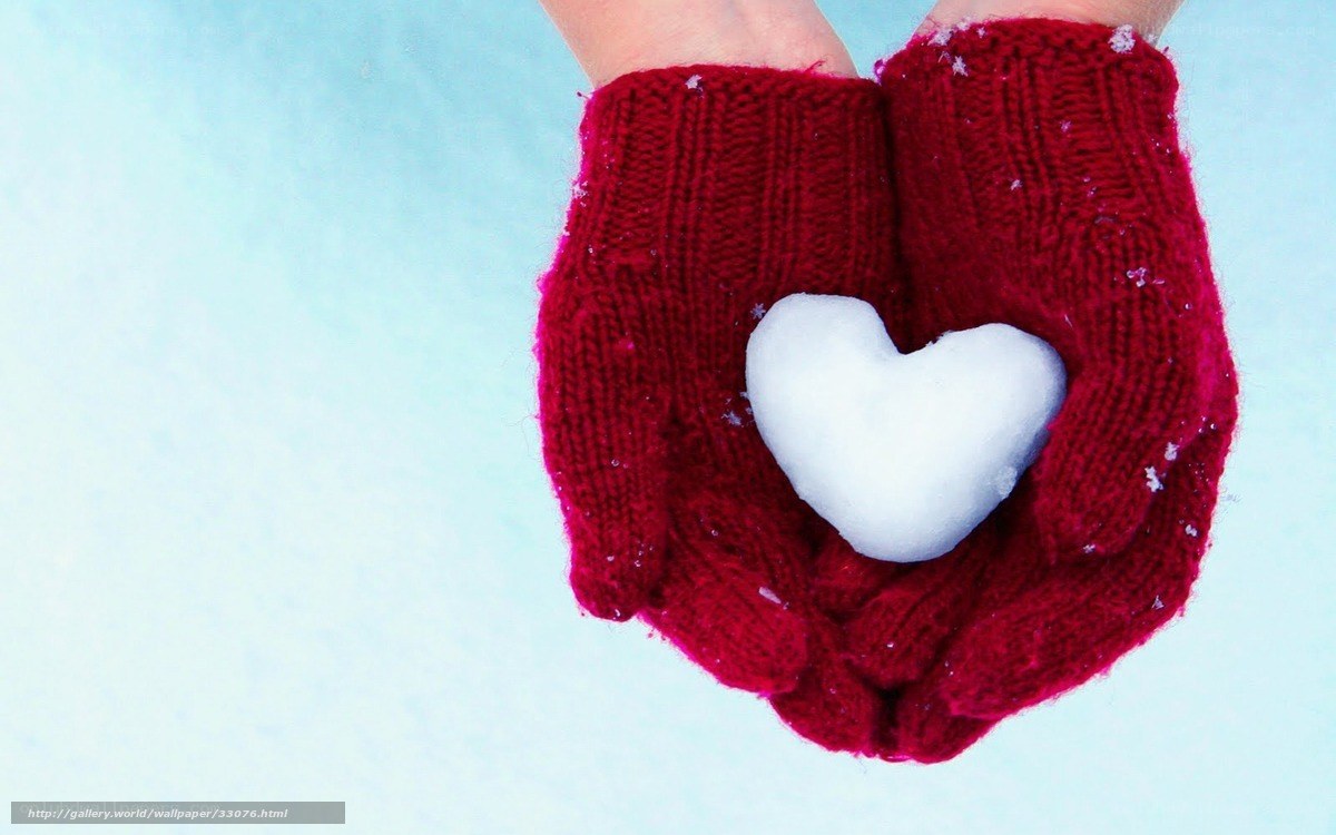 hands holding snow heart