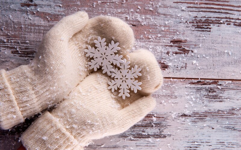 Hands Holding Snowflakes