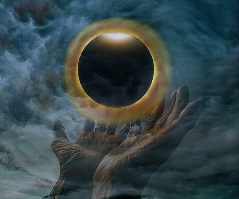 Hands holding solar eclipse