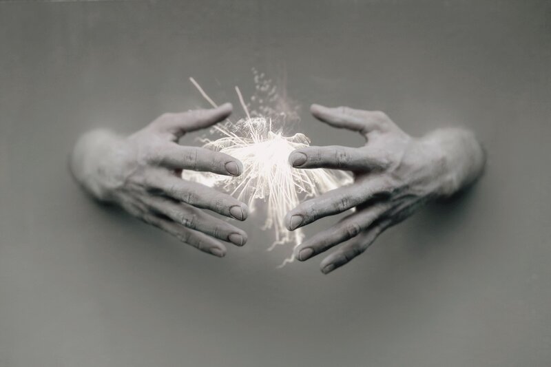 Hands Holding Spark