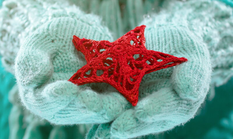 Hands Holding Star Ornament