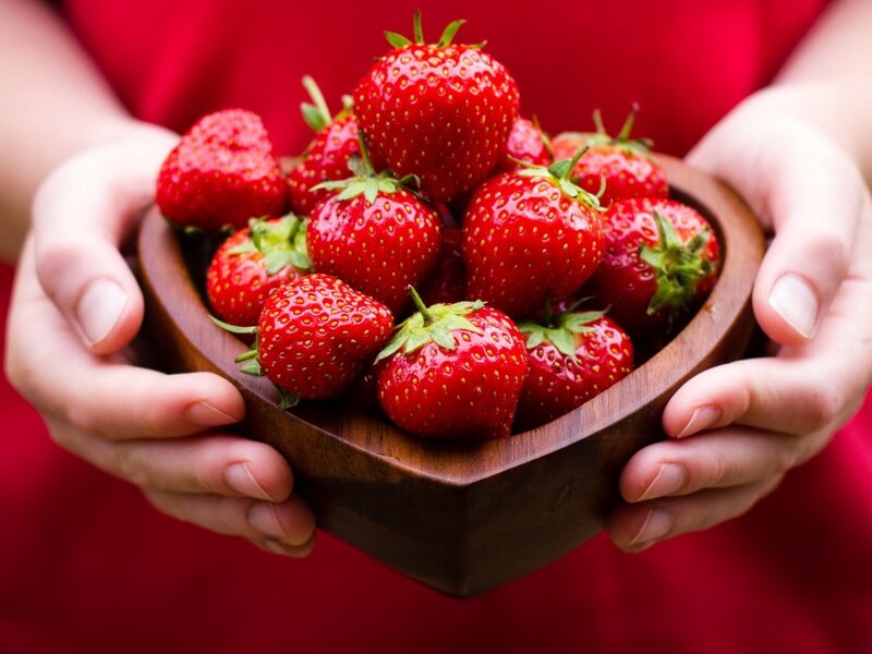 Hands Holding Strawberries — Red