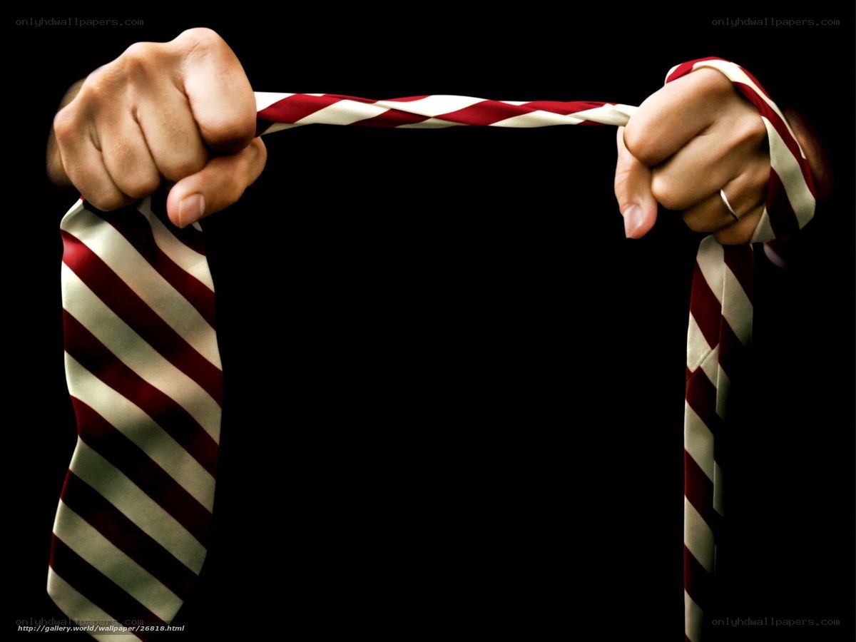 Hands holding striped tie