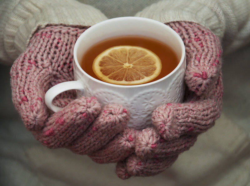 Hands Holding Tea Cup — White