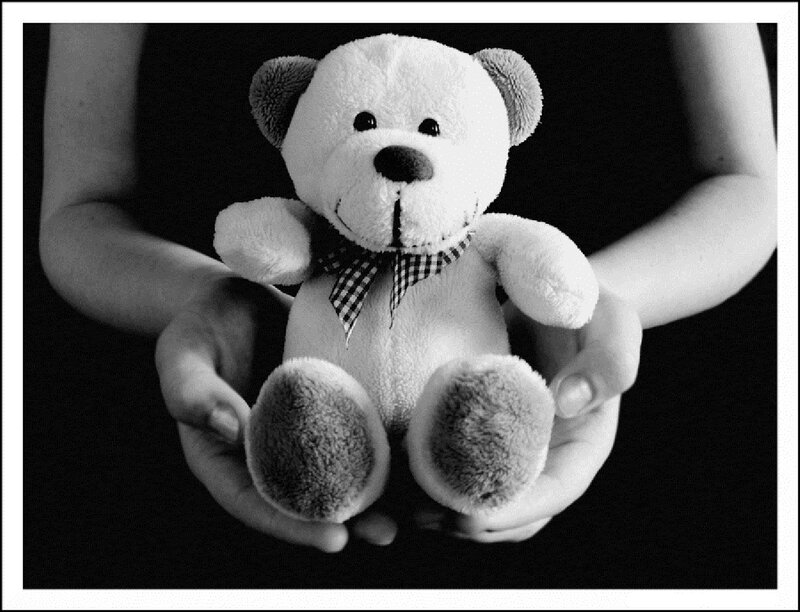 Hands Holding Teddy Bear