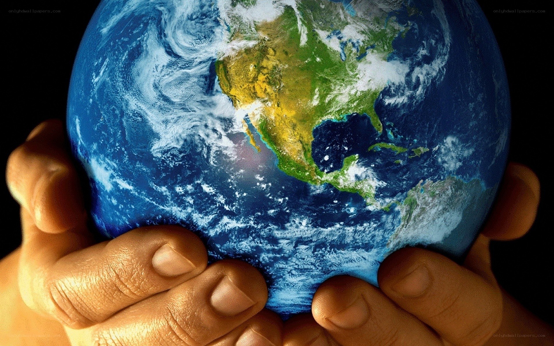 hands holding the earth