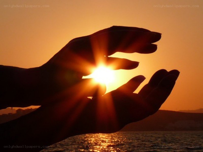 hands holding the sun