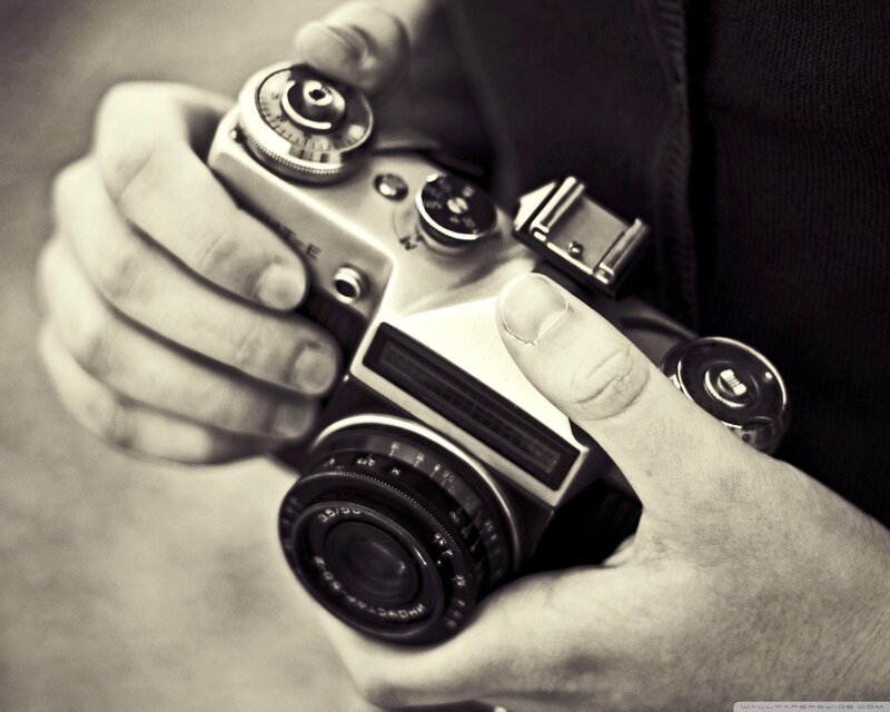 hands holding vintage camera