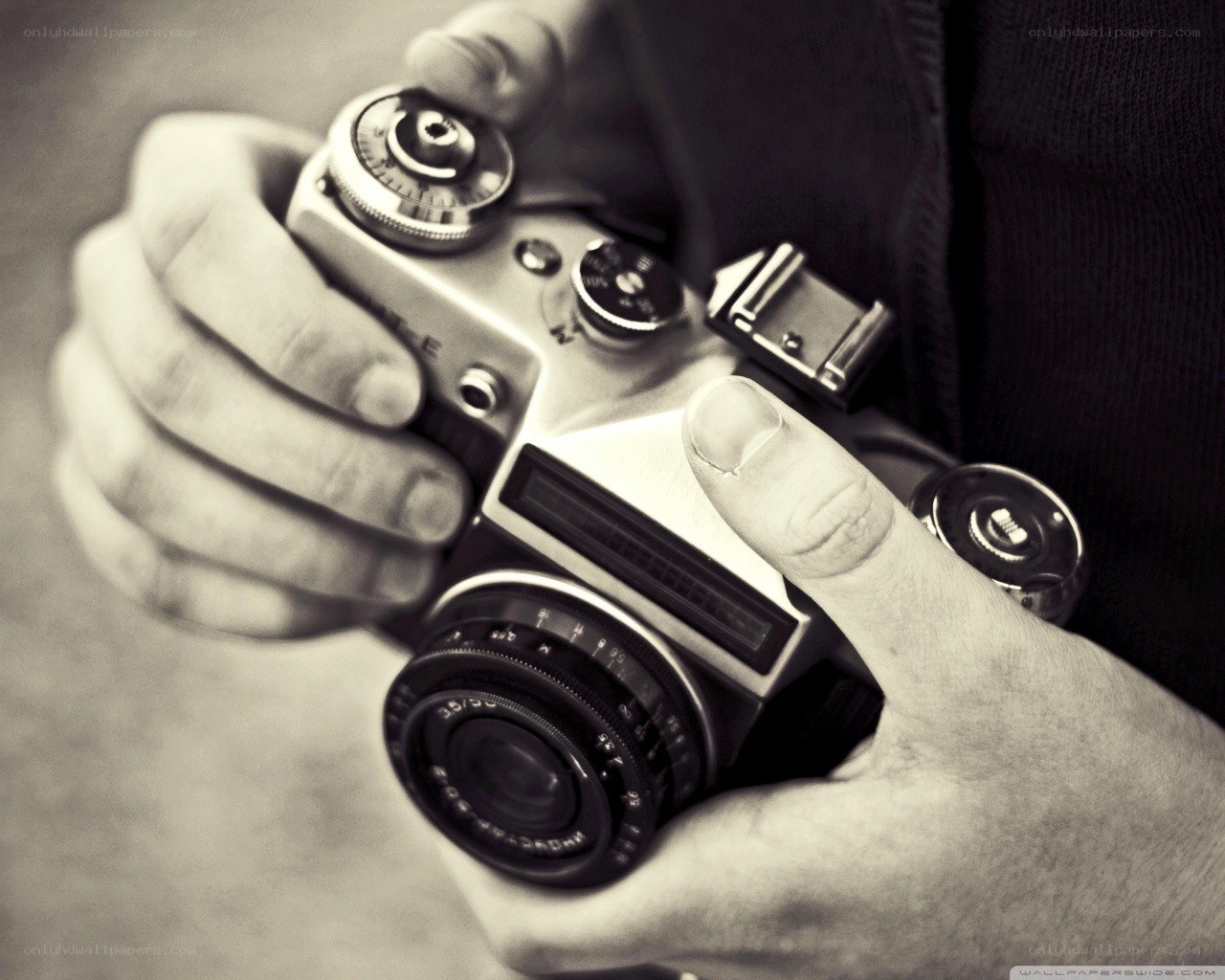 hands holding vintage camera