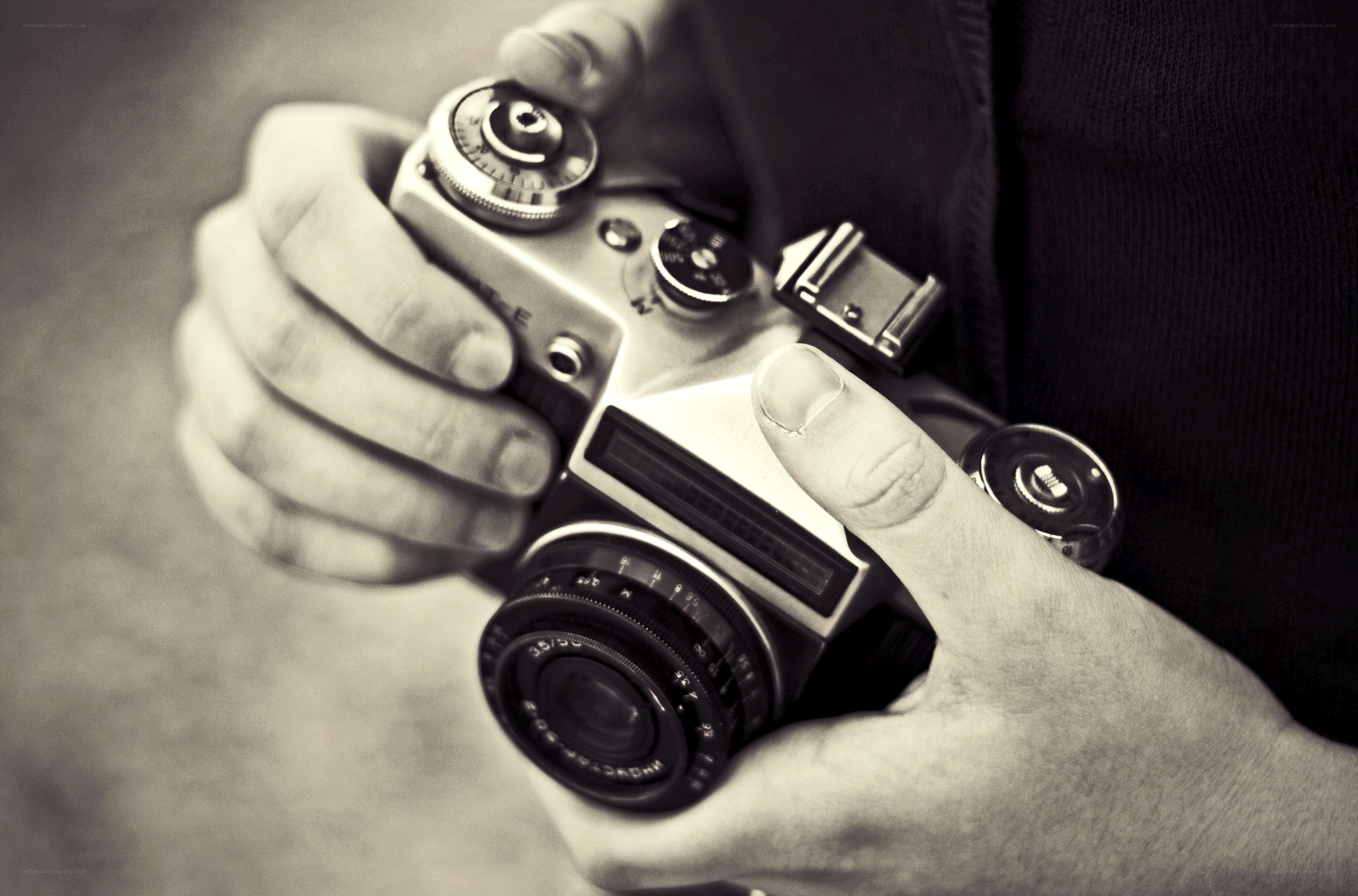 hands holding vintage camera