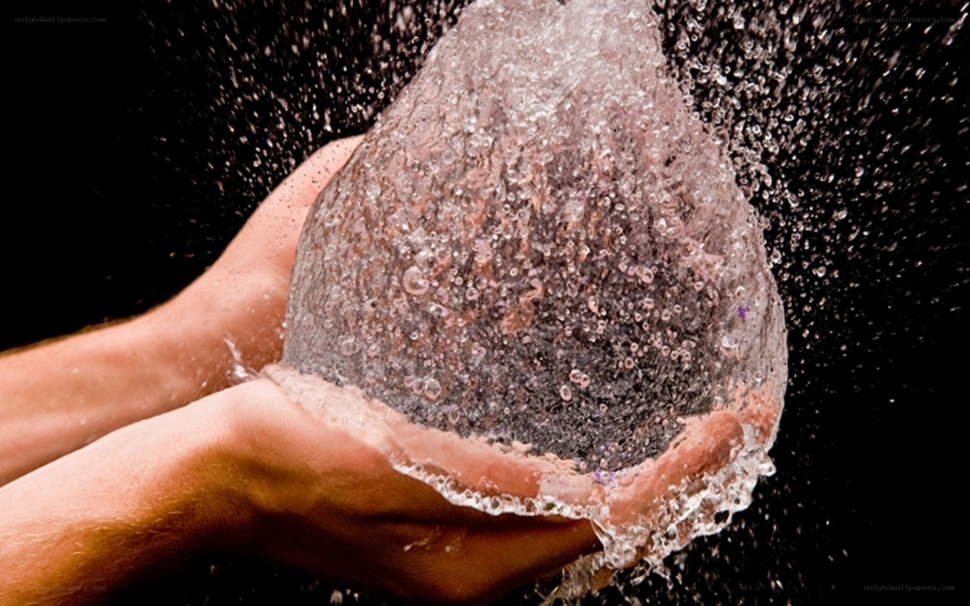 hands holding water balloon