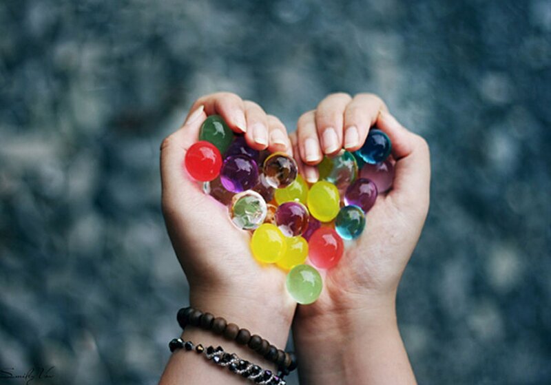 Hands Holding Water Beads