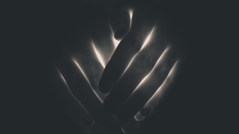 Hands in Dark Light
