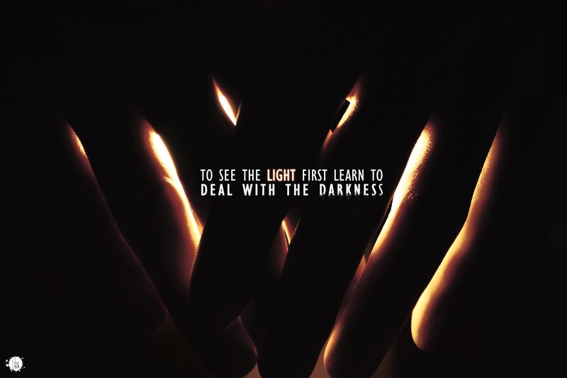 hands in darkness with light