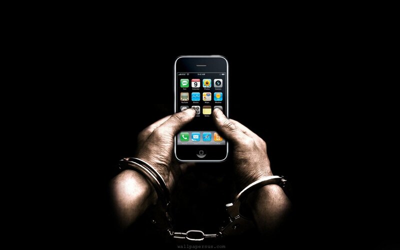 Hands in Handcuffs Holding Phone