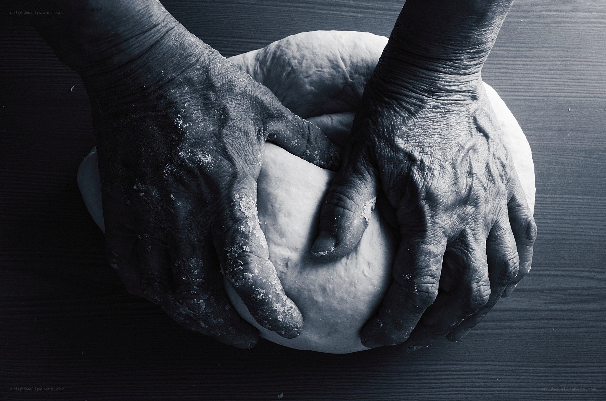 hands kneading dough