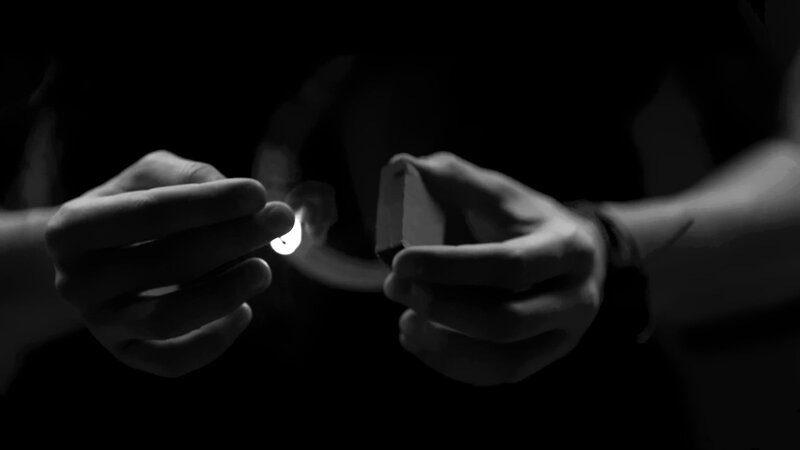 Hands Lighting Match