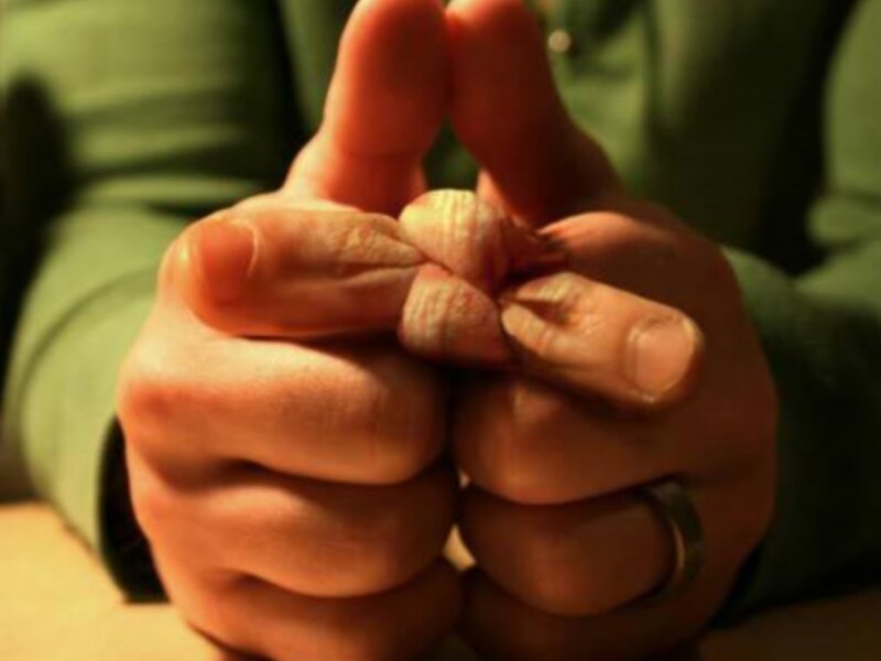 hands making a knot
